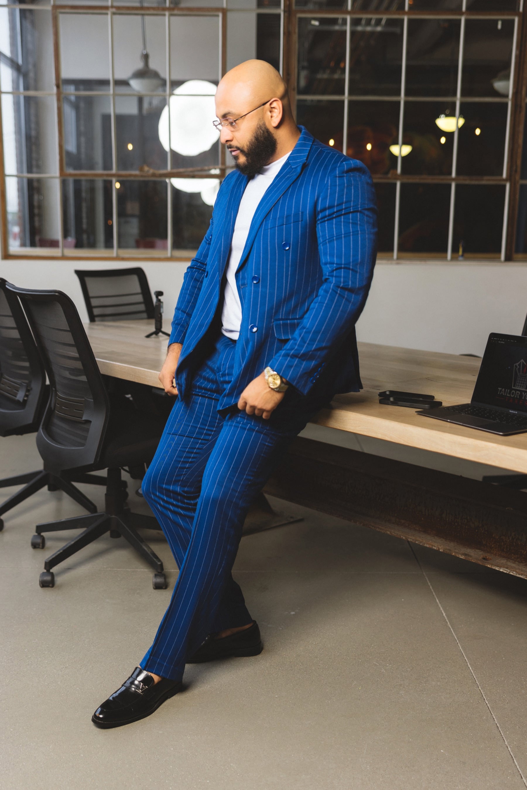 Angelo Garay, founder of Tailor Your Credit, in a blue suit